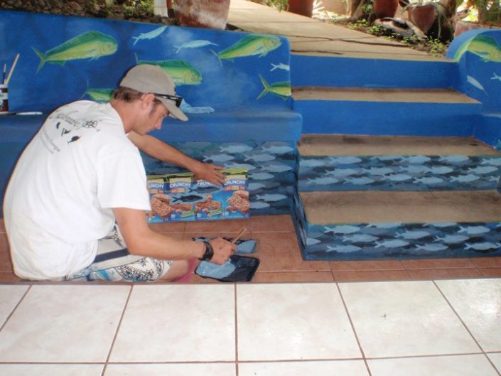 Stenciling a school of sardines around the stairs